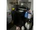 Laundry room with washer, dryer, and storage shelving at 1153 Tamarac Dr, Holiday, FL 34690