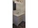 Updated bathroom with white vanity, new lighting, and a modern design at 1153 Tamarac Dr, Holiday, FL 34690