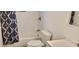 Clean bathroom with white subway tiles and a white toilet at 1153 Tamarac Dr, Holiday, FL 34690