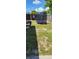 Backyard with a trampoline and a partially fenced area at 1153 Tamarac Dr, Holiday, FL 34690