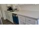 Modern kitchen with white cabinets and quartz countertops at 1153 Tamarac Dr, Holiday, FL 34690