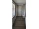 Entryway with wood-look flooring, window, and built-in bench at 1153 Tamarac Dr, Holiday, FL 34690