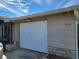 White garage door with house number 1153 visible at 1153 Tamarac Dr, Holiday, FL 34690