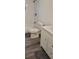 Updated bathroom with white vanity and fixtures at 1153 Tamarac Dr, Holiday, FL 34690