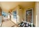 Inviting condo entrance featuring a secure screen door and textured exterior at 105 Island Way # 121, Clearwater Beach, FL 33767