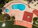 Complex pool and spa with surrounding deck and lounge chairs at 105 Island Way # 121, Clearwater Beach, FL 33767