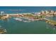Clearwater Beach marina with many boats and the beach in the background at 105 Island Way # 121, Clearwater Beach, FL 33767
