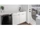 White wet bar with wine cooler and access to deck at 540 Dr Martin Luther King Jr S, St Petersburg, FL 33701