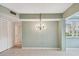 Light and airy dining area with a chandelier at 1001 Eden Isle Ne Dr # 1, St Petersburg, FL 33704