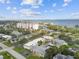 Aerial view of waterfront community featuring various residential buildings, lush landscaping, and a marina at 1001 Eden Isle Ne Dr # 1, St Petersburg, FL 33704