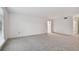Spacious living room with neutral carpeting and an open floor plan at 1001 Eden Isle Ne Dr # 1, St Petersburg, FL 33704