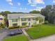 Two-story building exterior with landscaping at 1001 Eden Isle Ne Dr # 1, St Petersburg, FL 33704