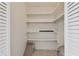 Empty pantry with ample shelving for storage at 1001 Eden Isle Ne Dr # 1, St Petersburg, FL 33704