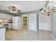 Kitchen features white appliances and granite countertops at 1001 Eden Isle Ne Dr # 1, St Petersburg, FL 33704