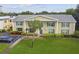 Two-story building with manicured lawn at 1001 Eden Isle Ne Dr # 1, St Petersburg, FL 33704