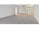 Bright living room featuring neutral walls and carpeted floors at 1001 Eden Isle Ne Dr # 1, St Petersburg, FL 33704