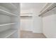 Large closet with ample shelving and hanging space at 1001 Eden Isle Ne Dr # 1, St Petersburg, FL 33704