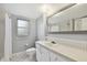 Bathroom with a vanity, shower, and updated fixtures at 1001 Eden Isle Ne Dr # 1, St Petersburg, FL 33704