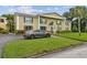 Two story building with landscaping and parking at 1001 Eden Isle Ne Dr # 1, St Petersburg, FL 33704
