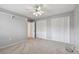 Bedroom with neutral walls, carpet, and double closets at 1001 Eden Isle Ne Dr # 1, St Petersburg, FL 33704
