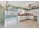 Open kitchen layout with a view of the dining area and sunroom at 1001 Eden Isle Ne Dr # 1, St Petersburg, FL 33704