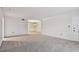 Living room with carpeted floors and an open layout at 1001 Eden Isle Ne Dr # 1, St Petersburg, FL 33704