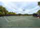 Outdoor tennis courts with ample space for play at 6436 Summit View Dr, Brooksville, FL 34601