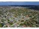 Aerial view of a residential neighborhood with a focus on one home at 13344 Sorrento Dr, Largo, FL 33774