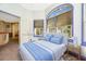 Bright bedroom with a queen bed and large window at 6375 Emanuels Way, Brooksville, FL 34602