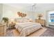 Bright and airy bedroom with a large bed and light-colored furnishings at 6375 Emanuels Way, Brooksville, FL 34602