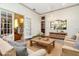 Virtually staged living room with comfortable seating and a coffee table at 6375 Emanuels Way, Brooksville, FL 34602
