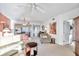 Bright living room with comfy seating and view into dining area at 1200 Country Club Dr # 5402, Largo, FL 33771