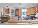 Living room with leather sofas and balcony access at 1200 Country Club Dr # 5402, Largo, FL 33771