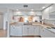 White kitchen with stainless steel appliances at 1200 Country Club Dr # 5402, Largo, FL 33771