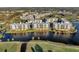 Aerial view of condo community near golf course and body of water at 1200 Country Club Dr # 5402, Largo, FL 33771