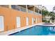 Community pool area with hot tub and building access at 692 Bayway Blvd # 202, Clearwater Beach, FL 33767