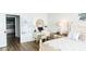 Main bedroom with a king-size bed, desk and en-suite bathroom at 692 Bayway Blvd # 202, Clearwater Beach, FL 33767