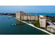 Aerial view of the building complex highlighting waterfront location, community pool, and boat access at 5130 Brittany S Dr # 408, St Petersburg, FL 33715