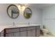 Bathroom boasts double vanity and oval mirrors at 5130 Brittany S Dr # 408, St Petersburg, FL 33715