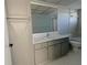 Updated bathroom with gray vanity and bathtub at 5130 Brittany S Dr # 408, St Petersburg, FL 33715
