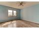 Light blue bedroom with hardwood floors and water view at 5130 Brittany S Dr # 408, St Petersburg, FL 33715