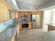 Updated kitchen with stainless steel appliances and granite countertops at 5130 Brittany S Dr # 408, St Petersburg, FL 33715