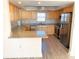 Modern kitchen featuring granite countertops and stainless steel appliances at 5130 Brittany S Dr # 408, St Petersburg, FL 33715