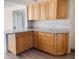 Kitchen with light wood cabinets and granite countertops at 5130 Brittany S Dr # 408, St Petersburg, FL 33715