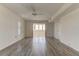 Sunlit living room with hardwood floors and access to a sunroom at 5130 Brittany S Dr # 408, St Petersburg, FL 33715
