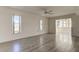 Open living room with hardwood floors and access to sunroom at 5130 Brittany S Dr # 408, St Petersburg, FL 33715