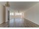 Spacious living room with hardwood floors and large windows at 5130 Brittany S Dr # 408, St Petersburg, FL 33715