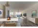 Spacious living room area with hardwood floors, bright natural light, and modern furniture at 5130 Brittany S Dr # 408, St Petersburg, FL 33715