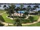 A beautiful pool area with a large pool, lounge chairs, and palm trees, perfect for relaxation at 5130 Brittany S Dr # 408, St Petersburg, FL 33715