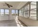 Sunroom with hardwood floors and city views at 5130 Brittany S Dr # 408, St Petersburg, FL 33715